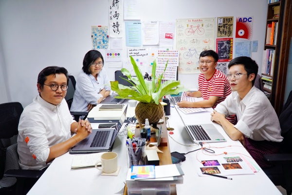 Founder of Behalf Studio Nguyen Hung Giang (front, left) and his team in which two are RMIT alumni work together to create the Hanoi-inspired typeface