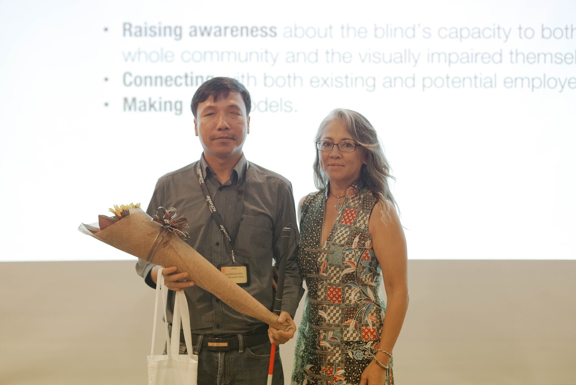 Director of Sao Mai Centre for the Blind Mr Dang Hoai Phuc (left) presented about the higher education support program in Vietnam which addresses the challenges and difficulties creating barriers for visually impaired students to equally and effectively access higher education.