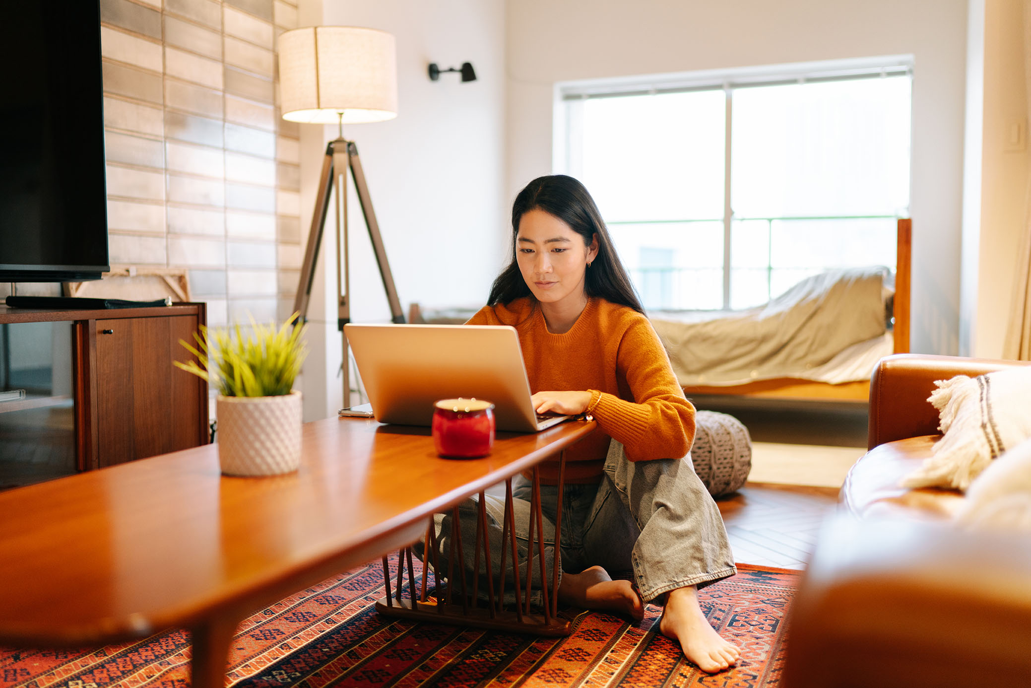 Female student on laptop at home.jpg