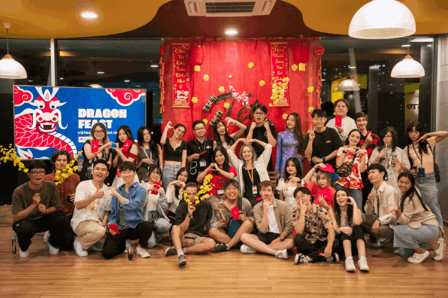 A group of people posing for a photo in a room.