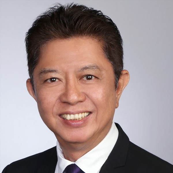 headshot of a man smiling