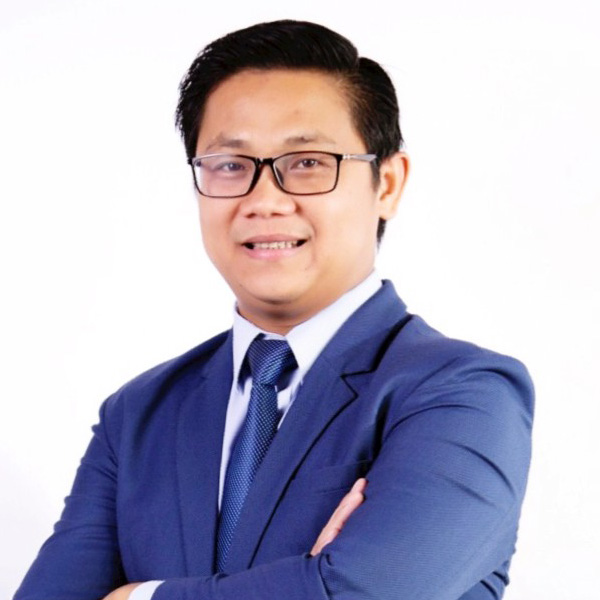 headshot of a man smiling