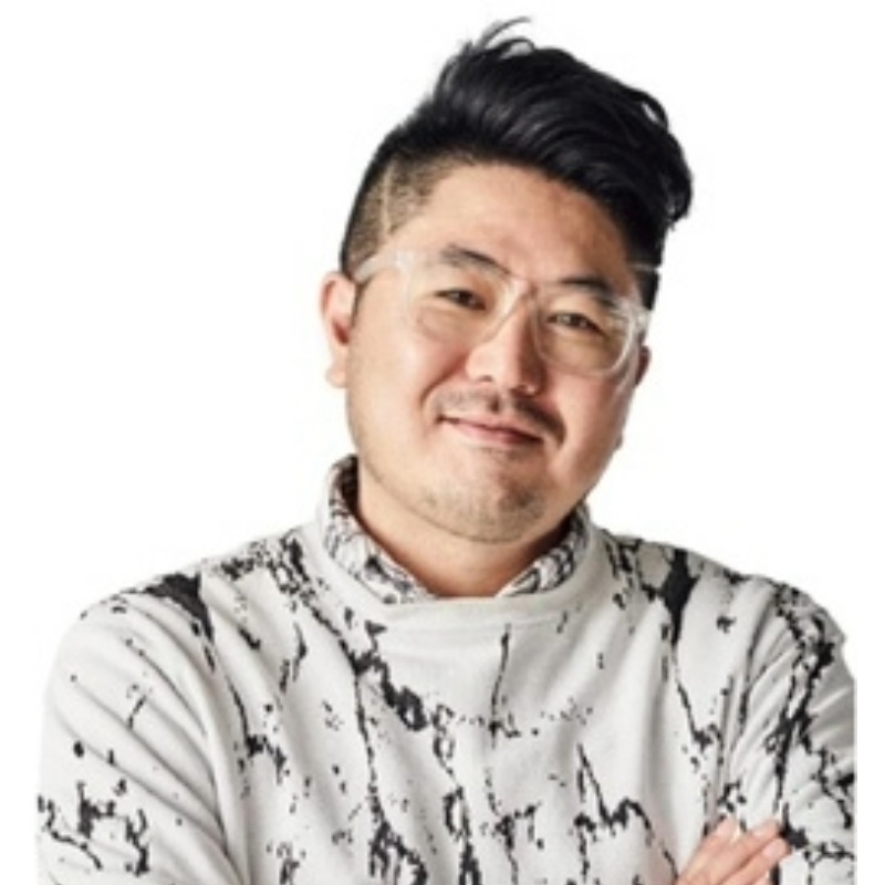 A man wearing a black and white t-shirt