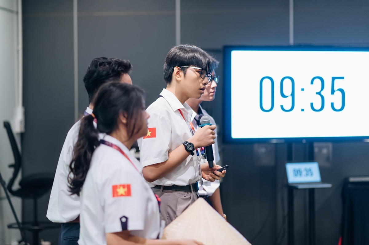 Contestants presenting their plan in a competition