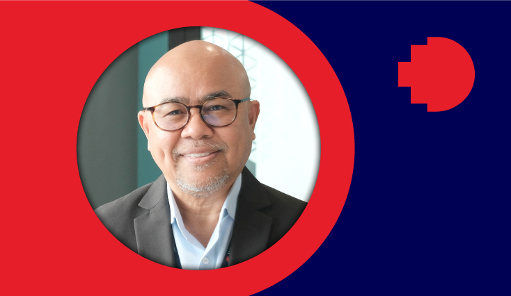 a headshot of a man smiling