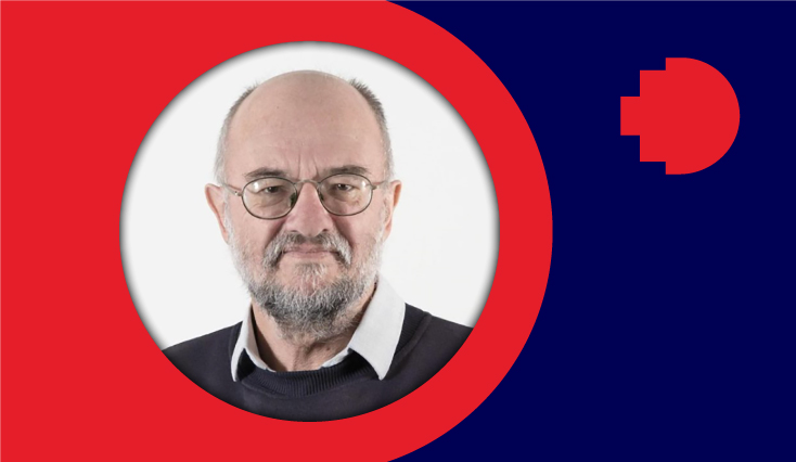 a headshot of a man smiling