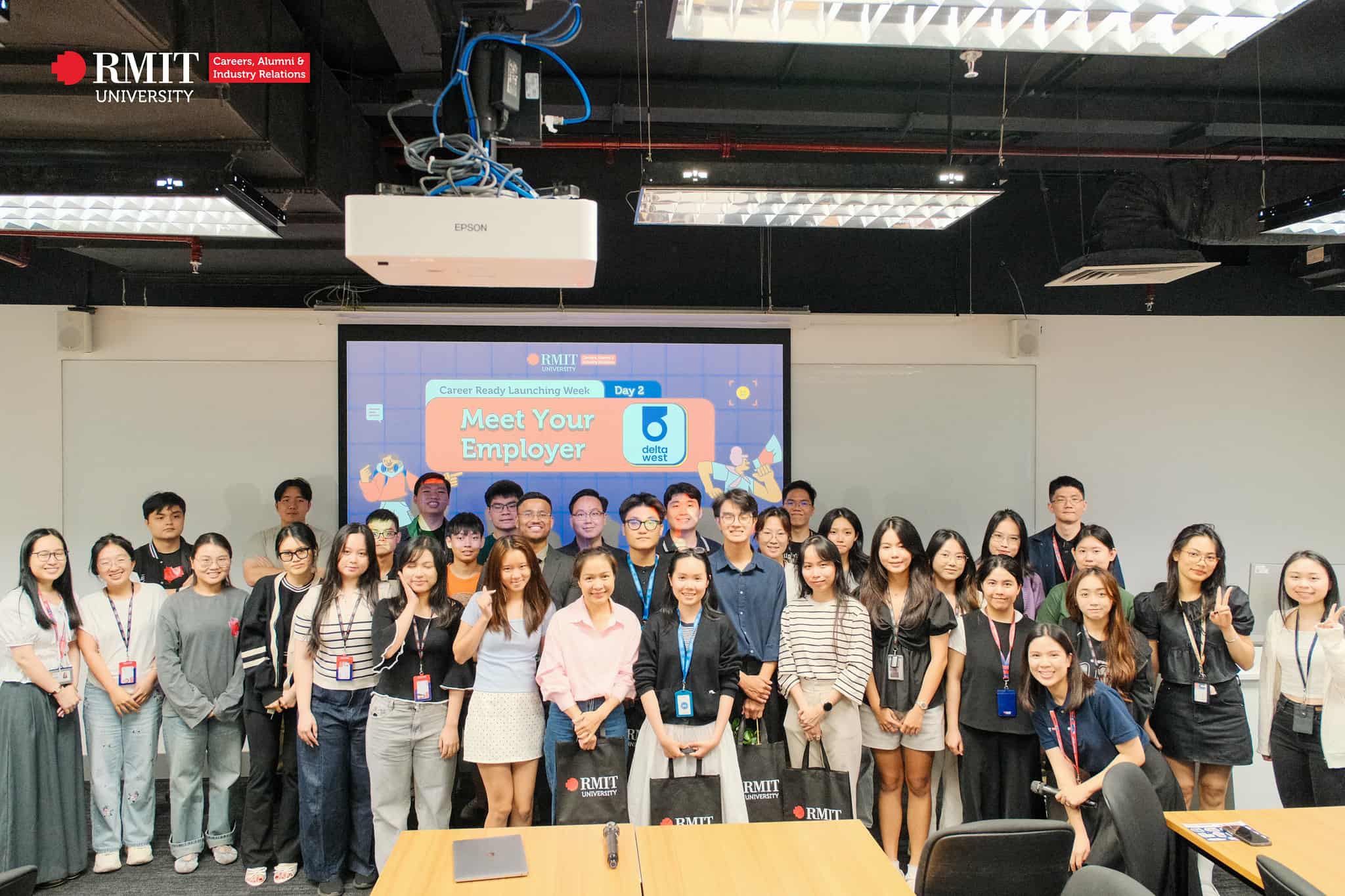 Group of attendees standing and smiling