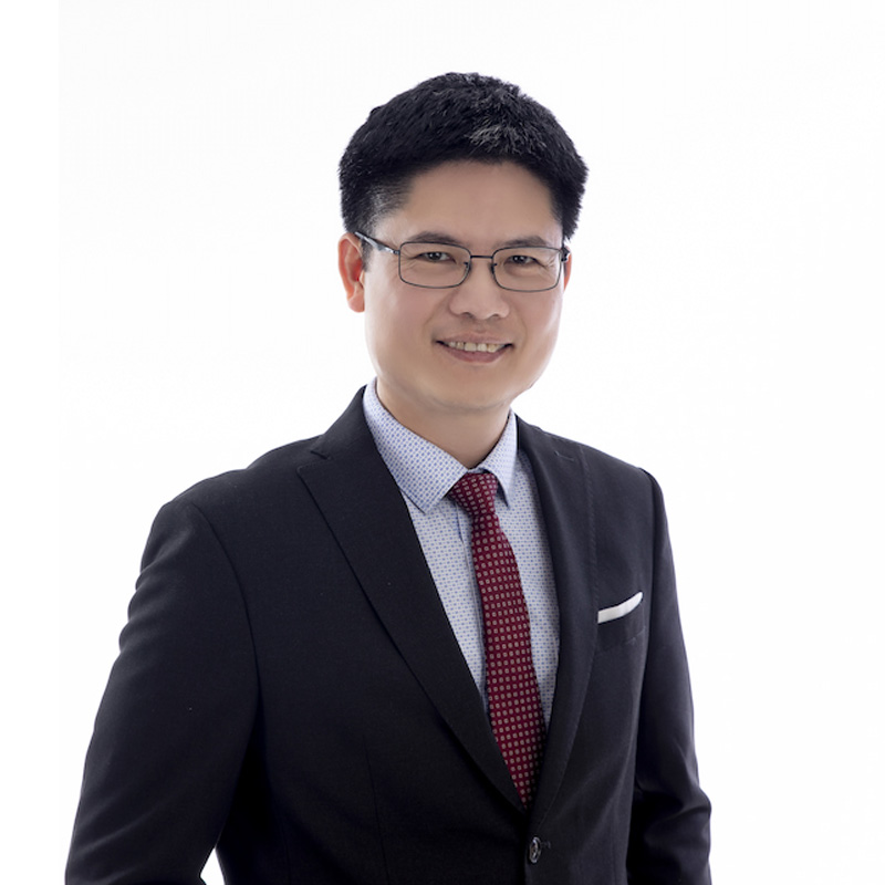 headshot of a man smiling