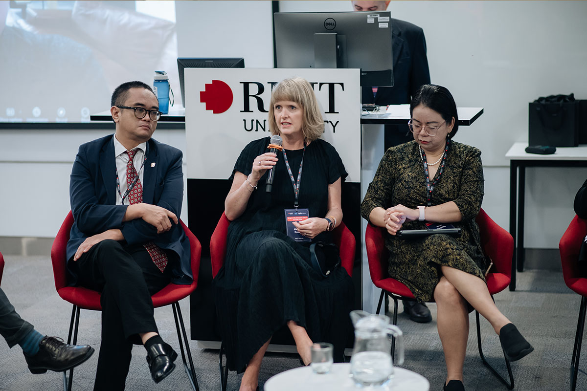Professor Melanie Davern is sitting on the chair