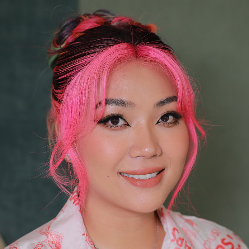a headshot of a woman smiling 