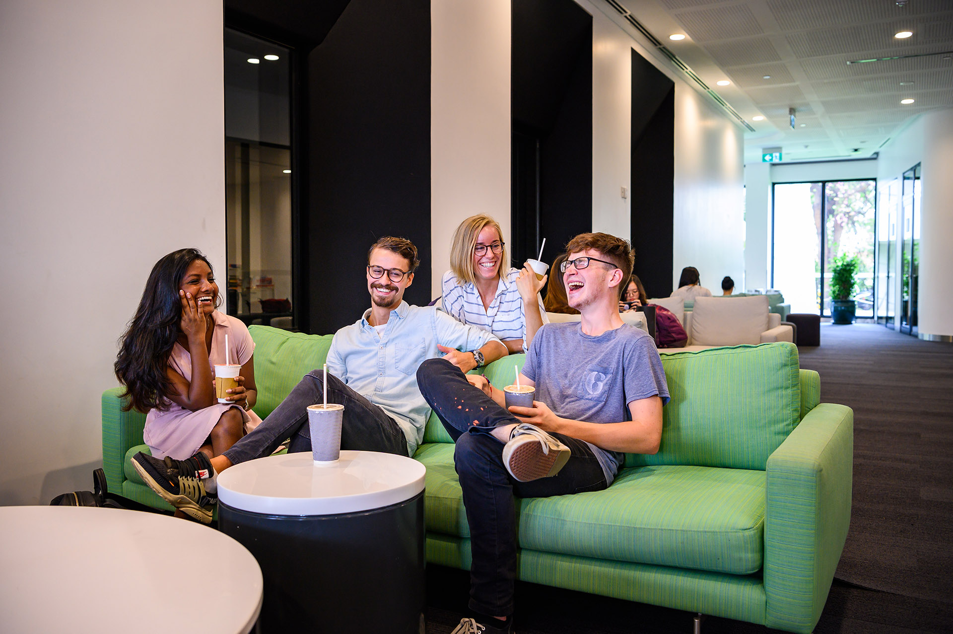 international students sitting chatting at the cafe 