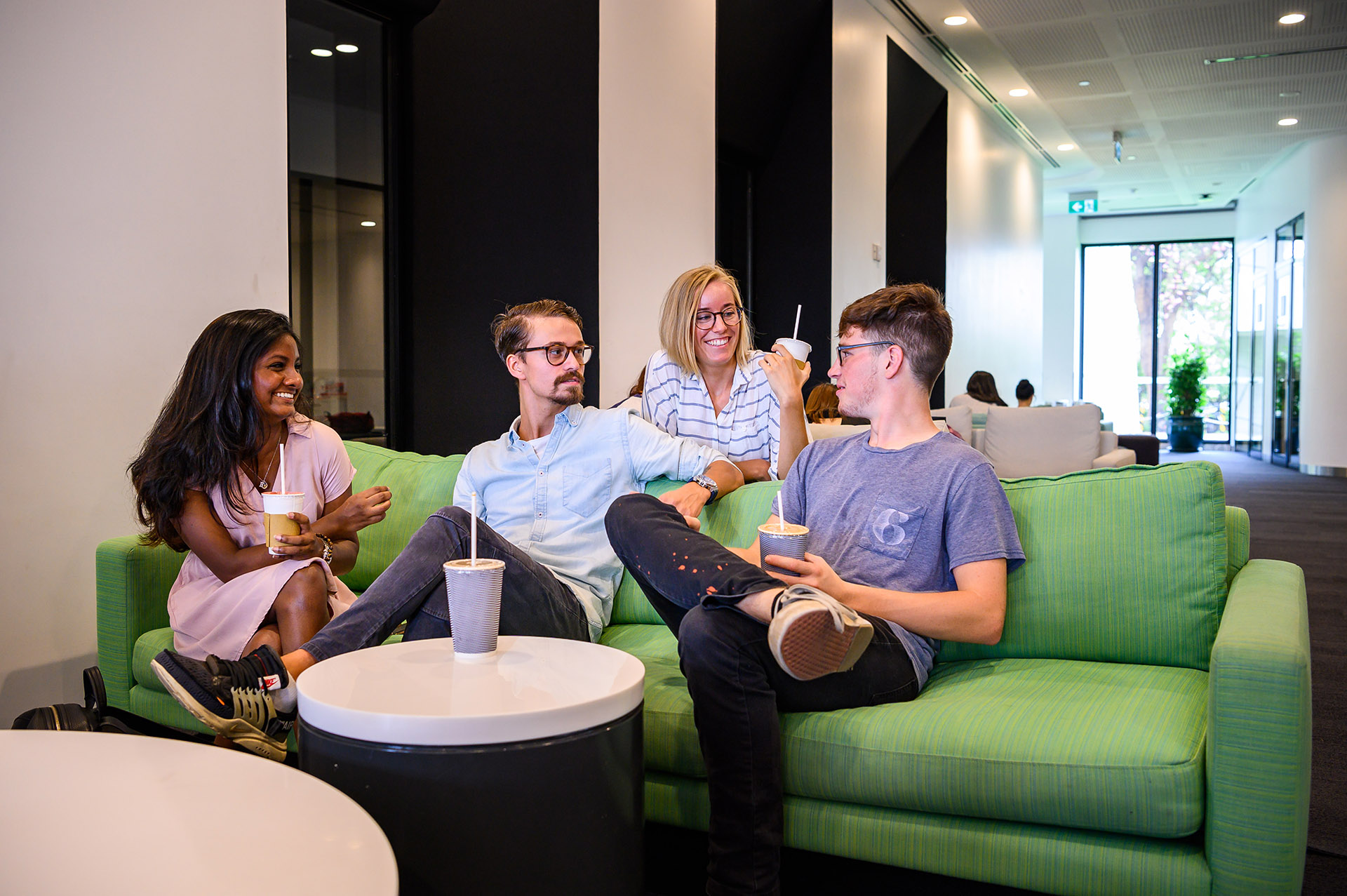 international students sitting at the coffee corner chatting 