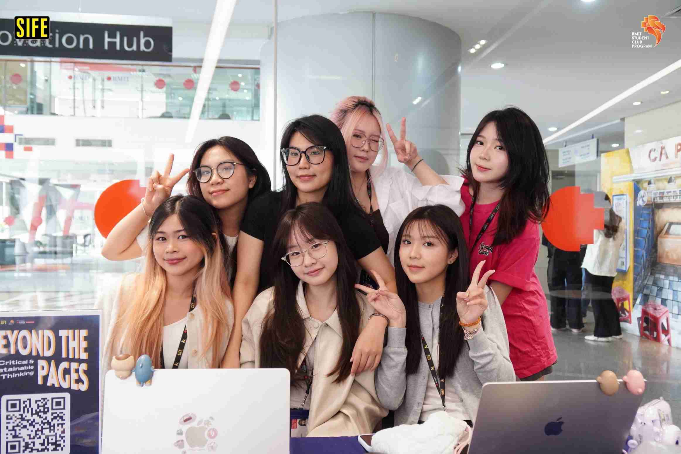 the photo showing a group of female students posing for a photograph