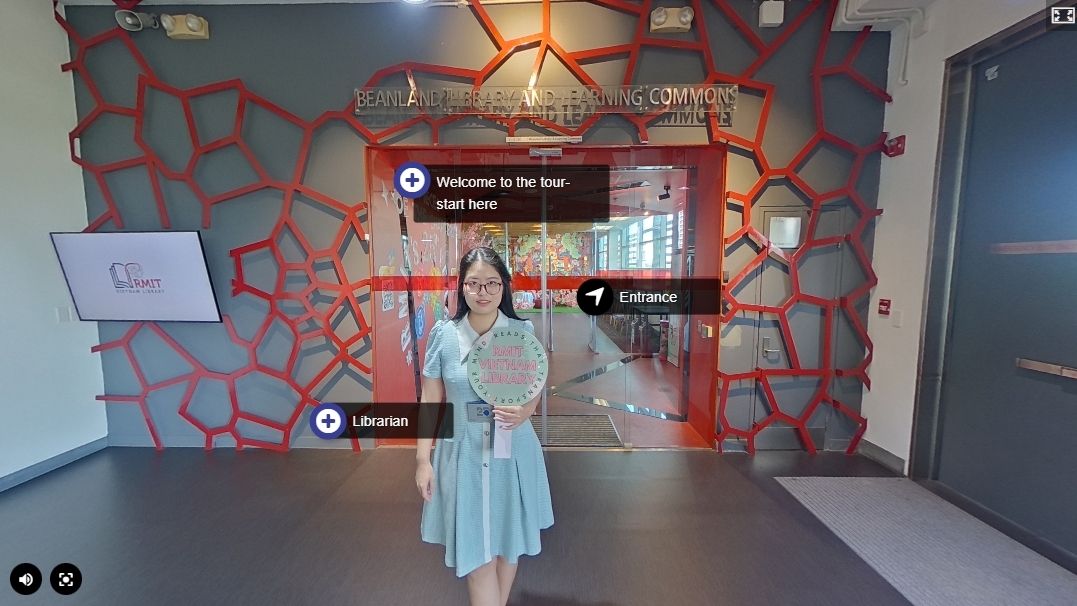 The photo is about a girl wearing blue dress, standing in front of a building. She is holding a signage on her hand.