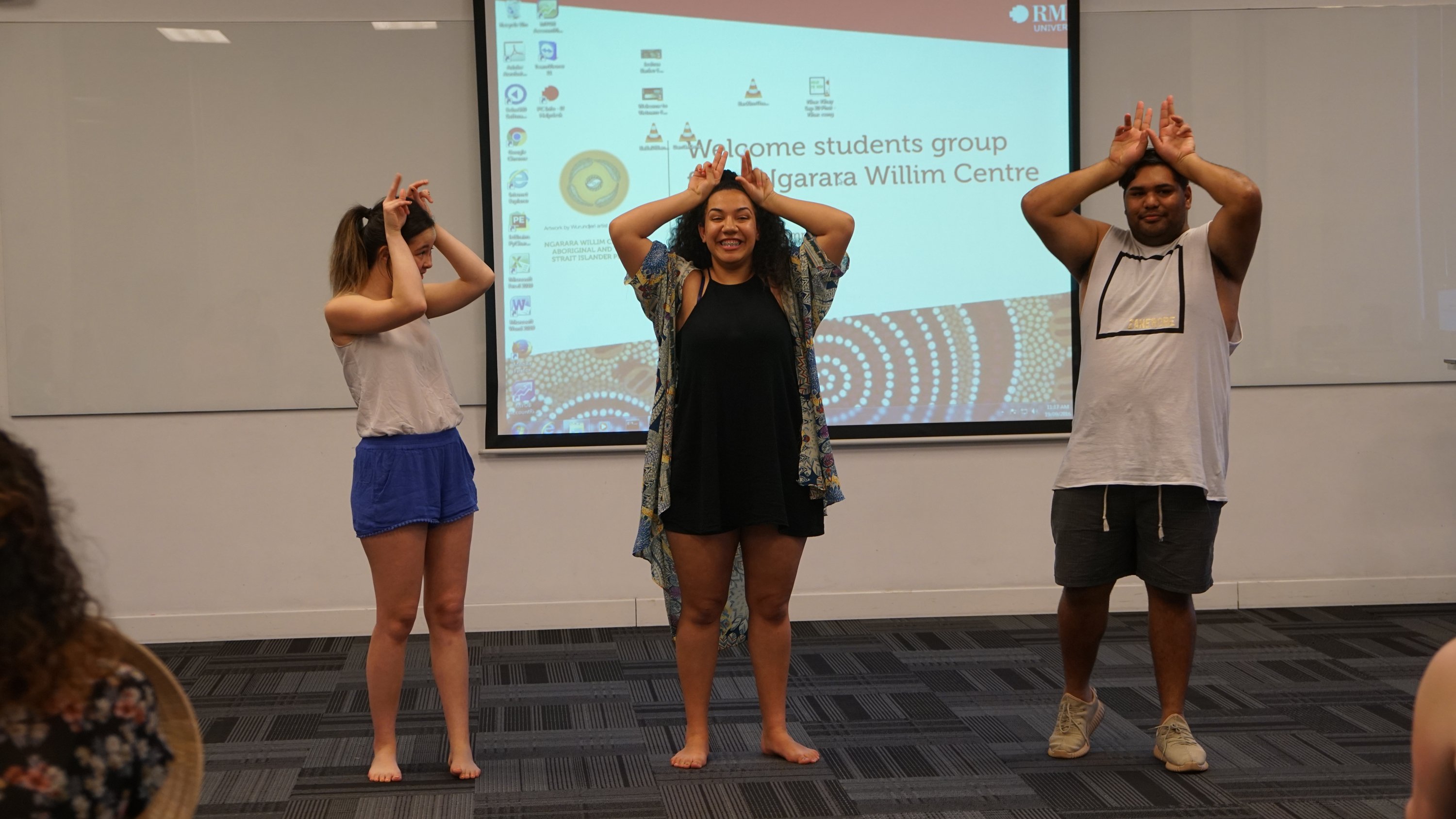 Kyralee Murphy-Edwards (middle), a Youth Work student at RMIT Melbourne, showed participants a dance which demonstrates cherry picking, a jumping kangaroo, and a flying eagle.