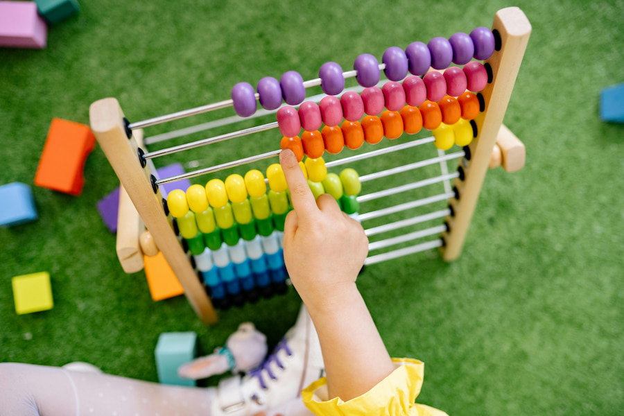 Child playing with abacus