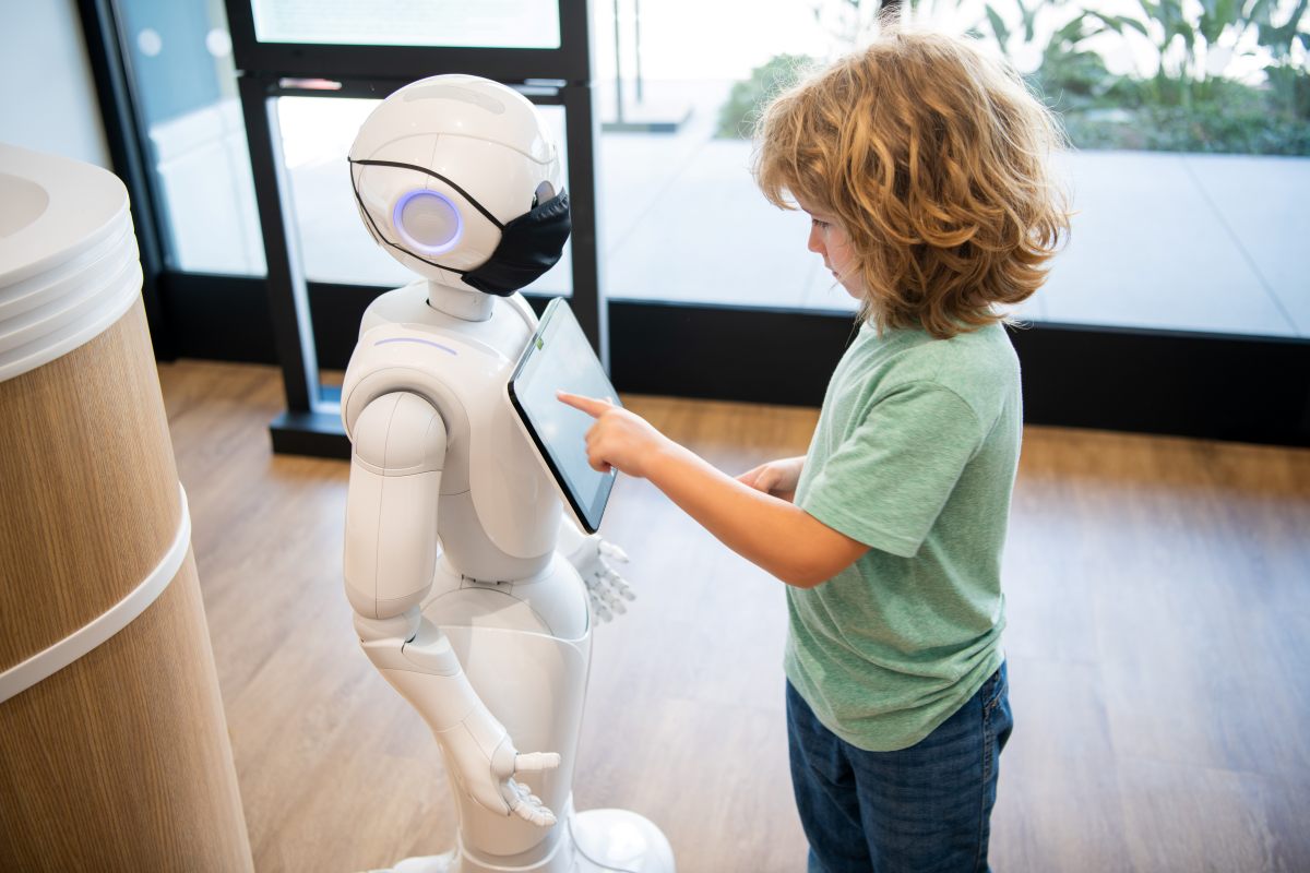 A child playing with a robot