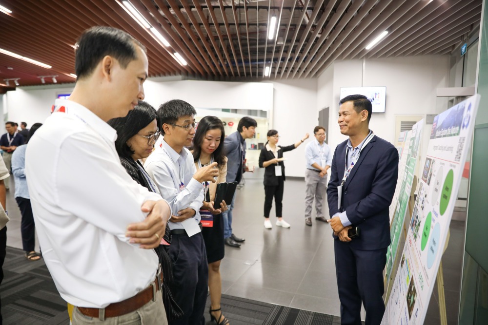 People looking at posters and discussing