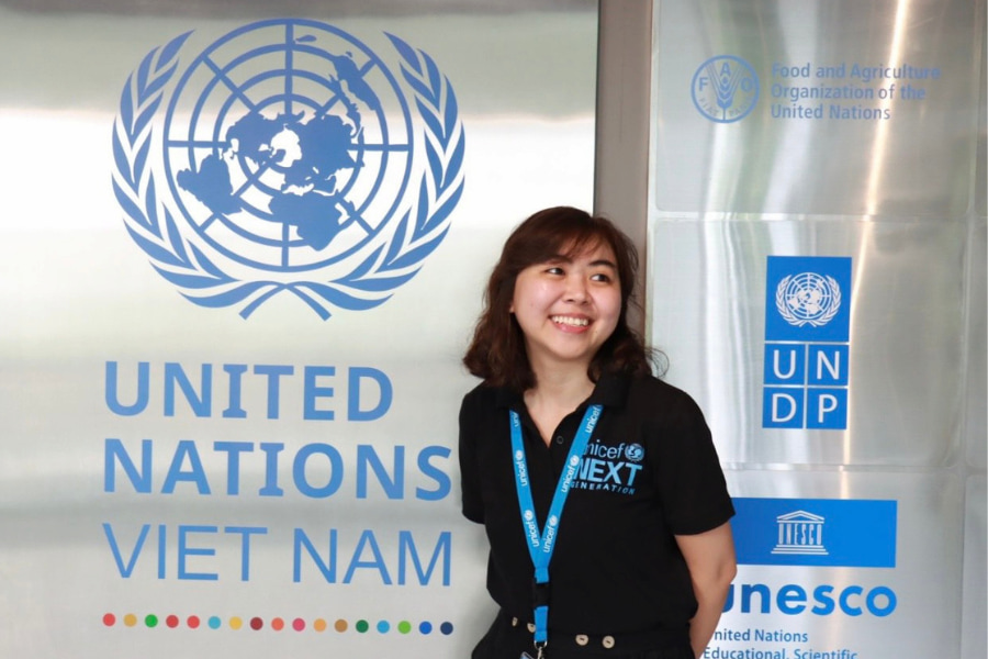 Duc Anh in front of the UN Vietnam sign