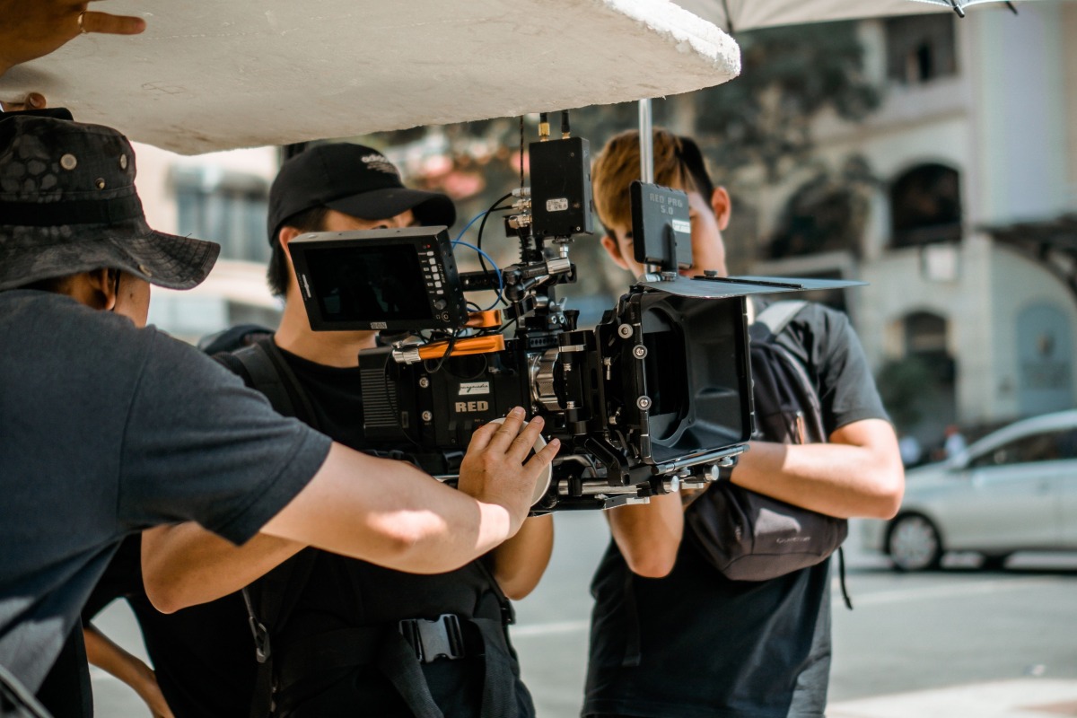 A film crew operating a camera