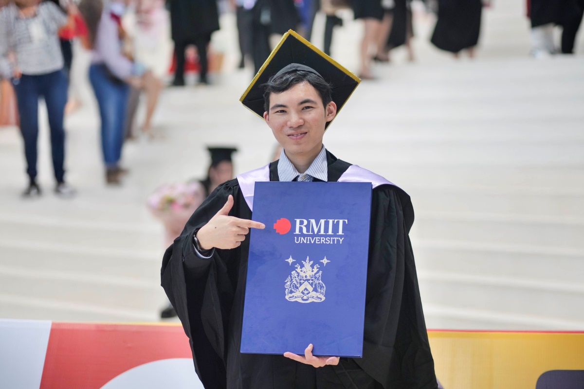 Ha Viet TInh in graduation gown