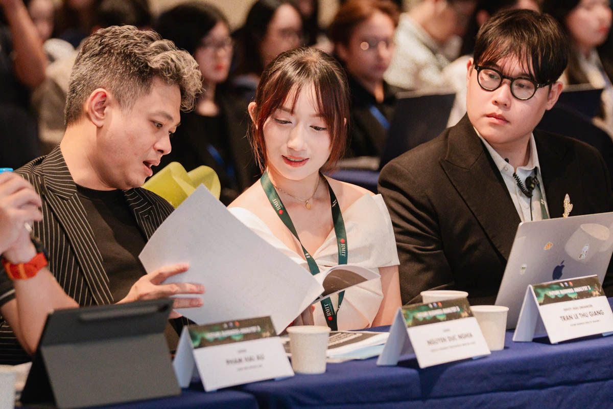 Three people sitting next to each other