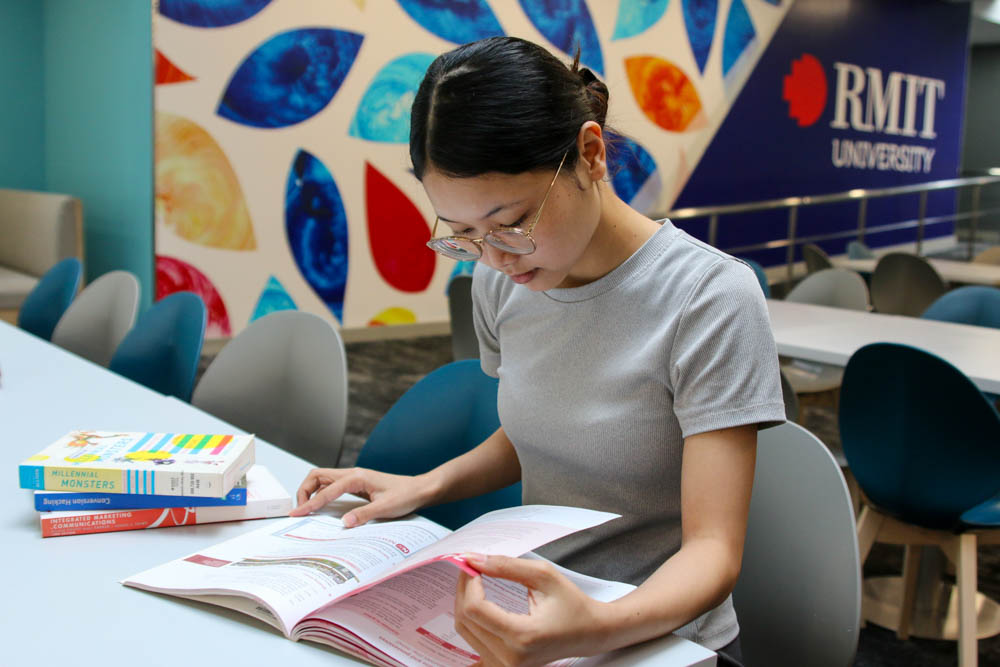 Quynh reading a book