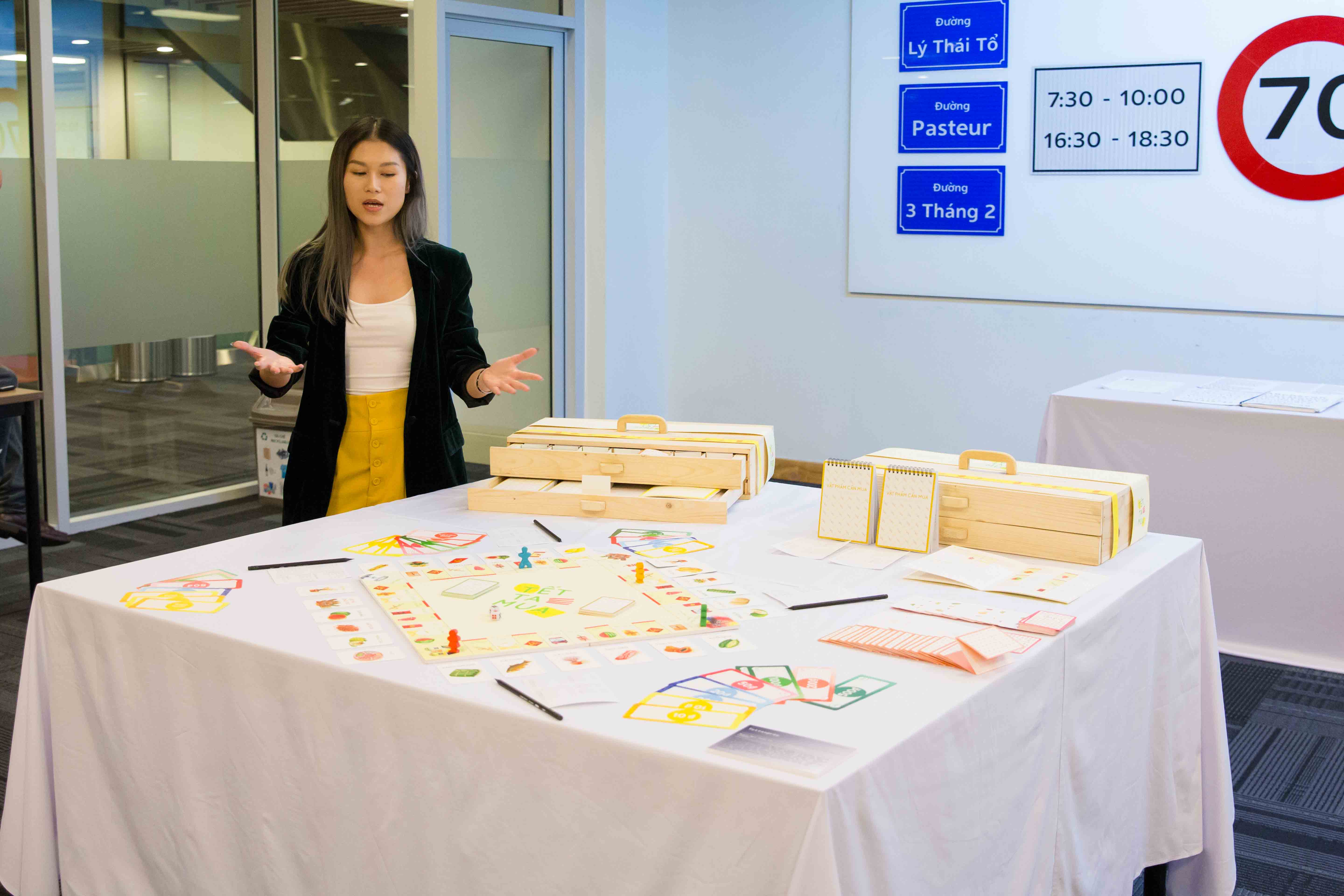 RMIT Vietnam graduate Nguyen Ngoc Thanh Tam presenting her designed game set in the class