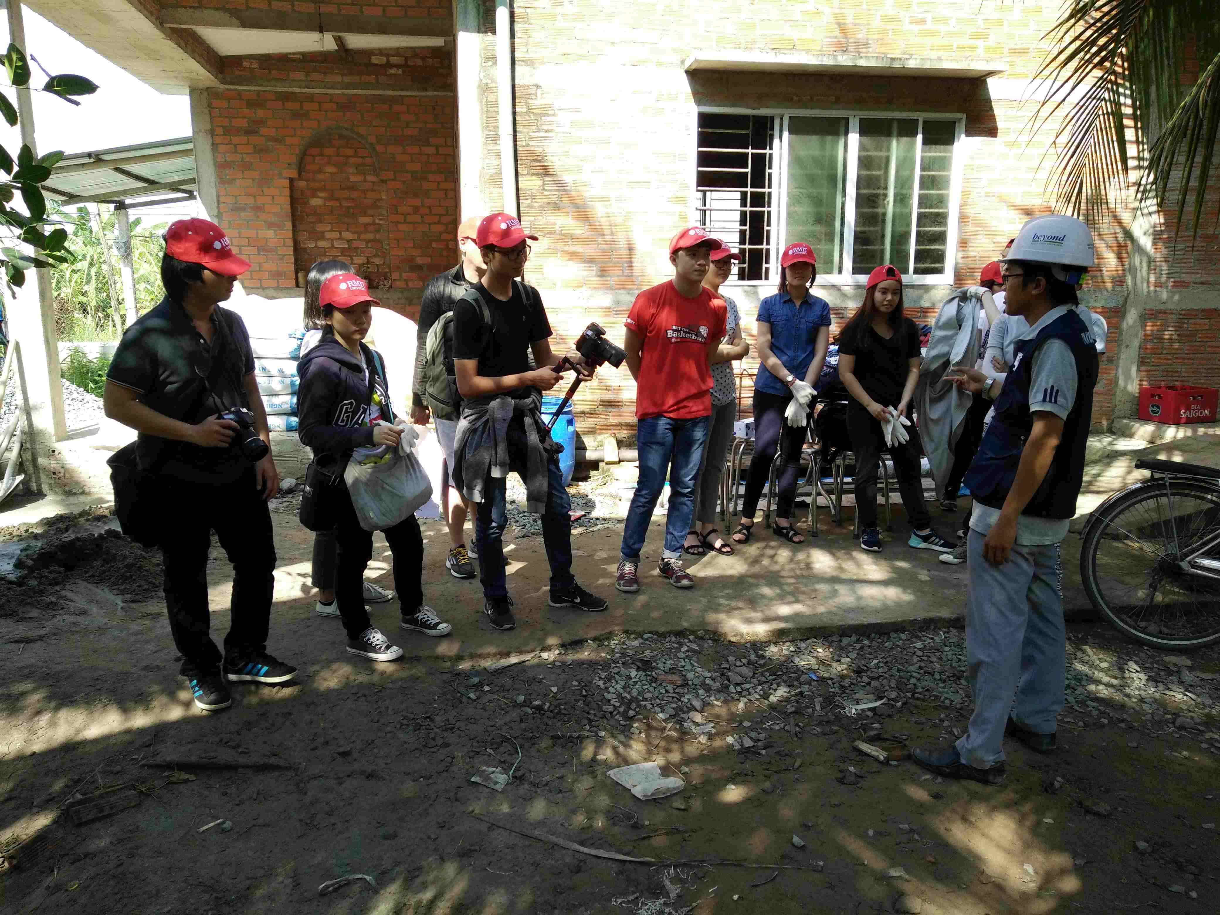 Bachelor of Design (Digital Media) students prepare to build a house in the Mekong Delta.