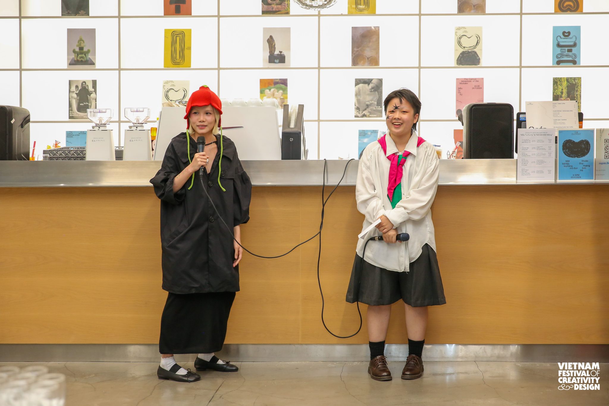 Two artists holding microphones