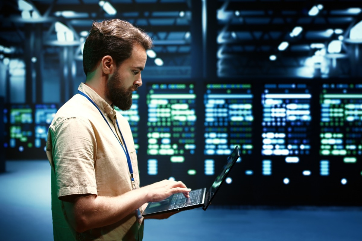 IT technician standing in a server room