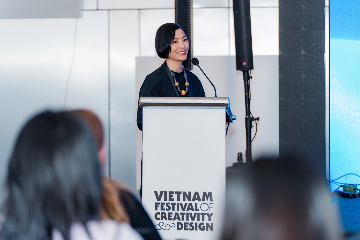 A woman speaking at a lectern