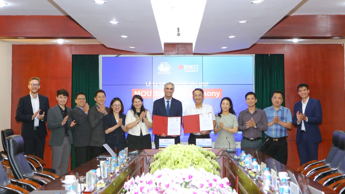 Group photo of delegates after MoU signing