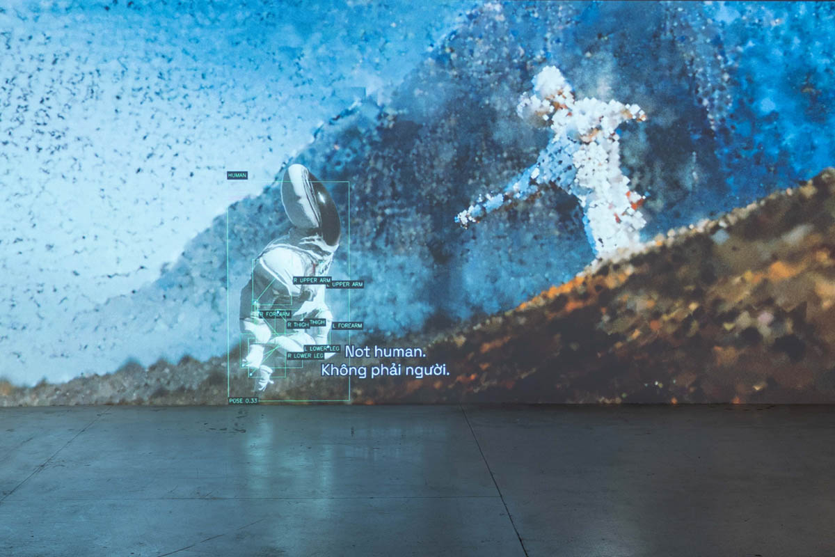 A video artwork showing the words "Not human"