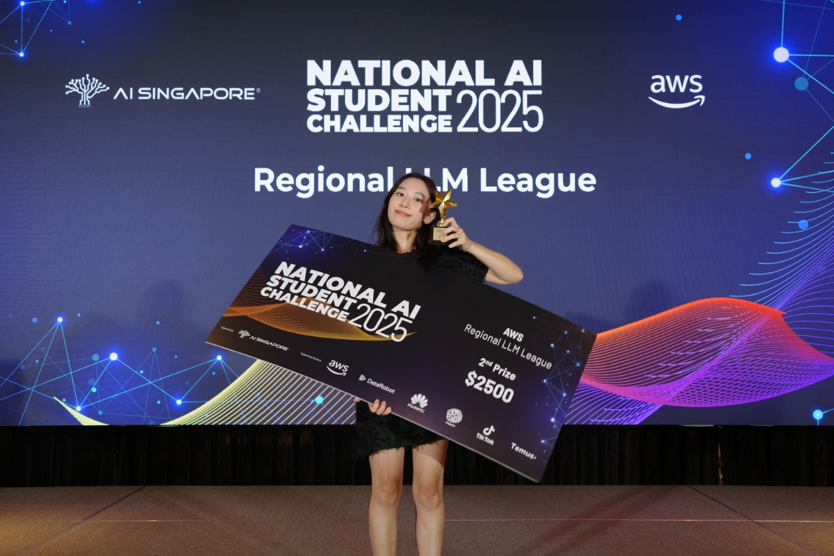 A proud moment for Seokyung Kim as she holds her award after excelling at her first international AI competition. (Photo: National AI Student Challenge 2025 by AI Singapore)