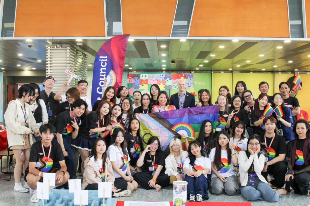 Group photo with Pride flag