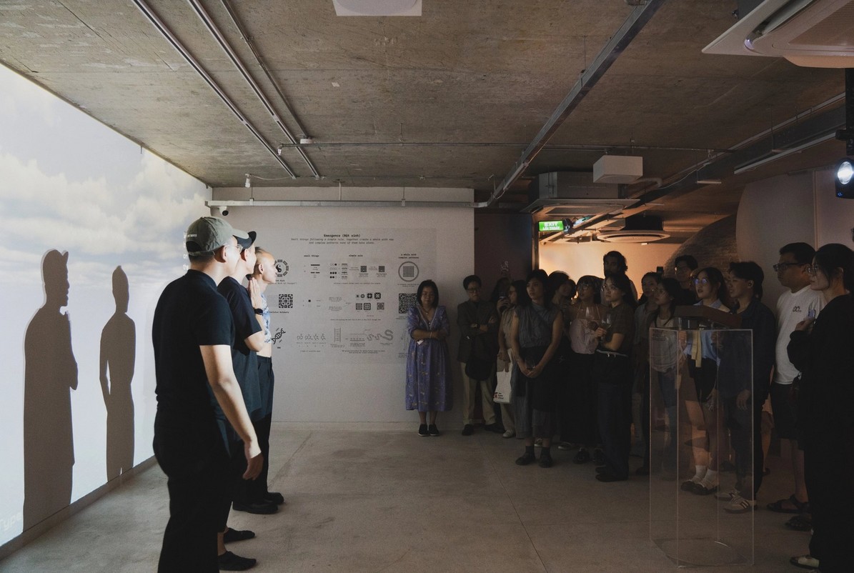 groups of people at an exhibition opening