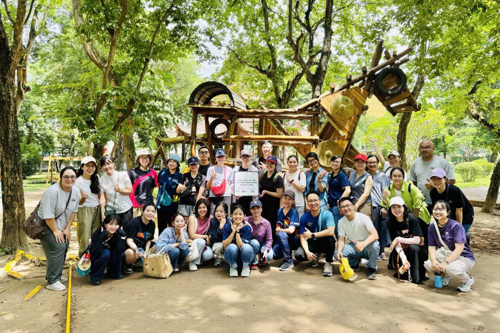 RMIT volunteers pose for a group photo in the Van Mieu public playground