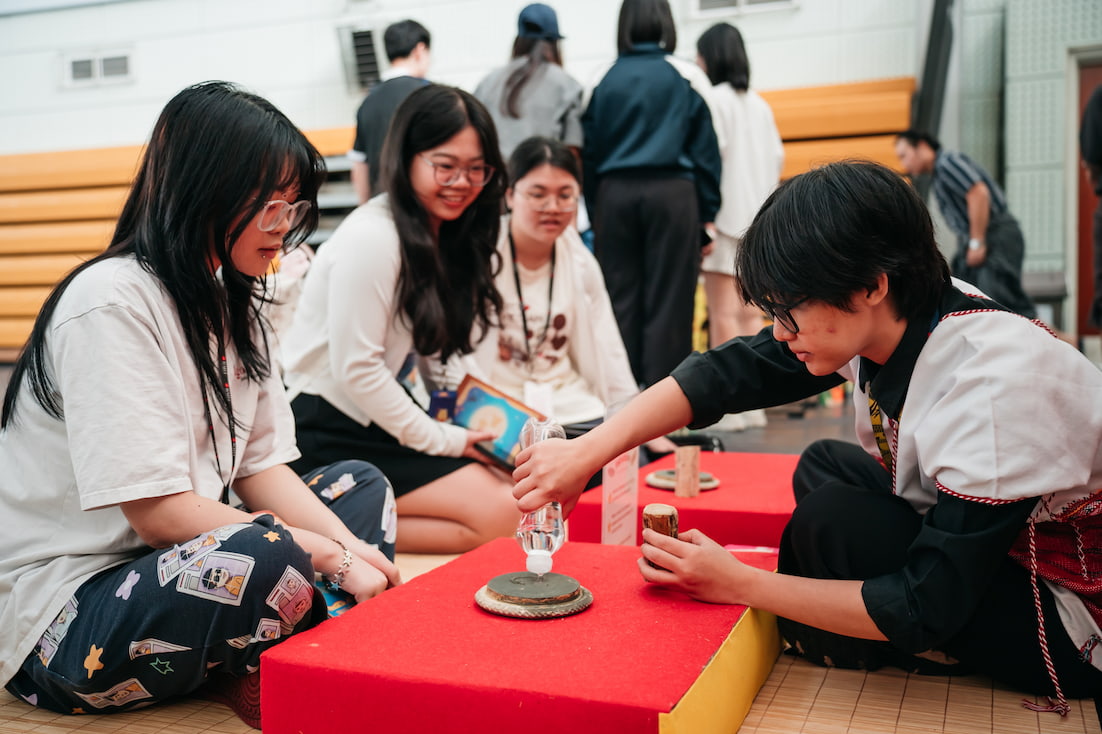 At the Myanmar booth, students learned how to make Thanaka, a traditional Myanmar sun cream.