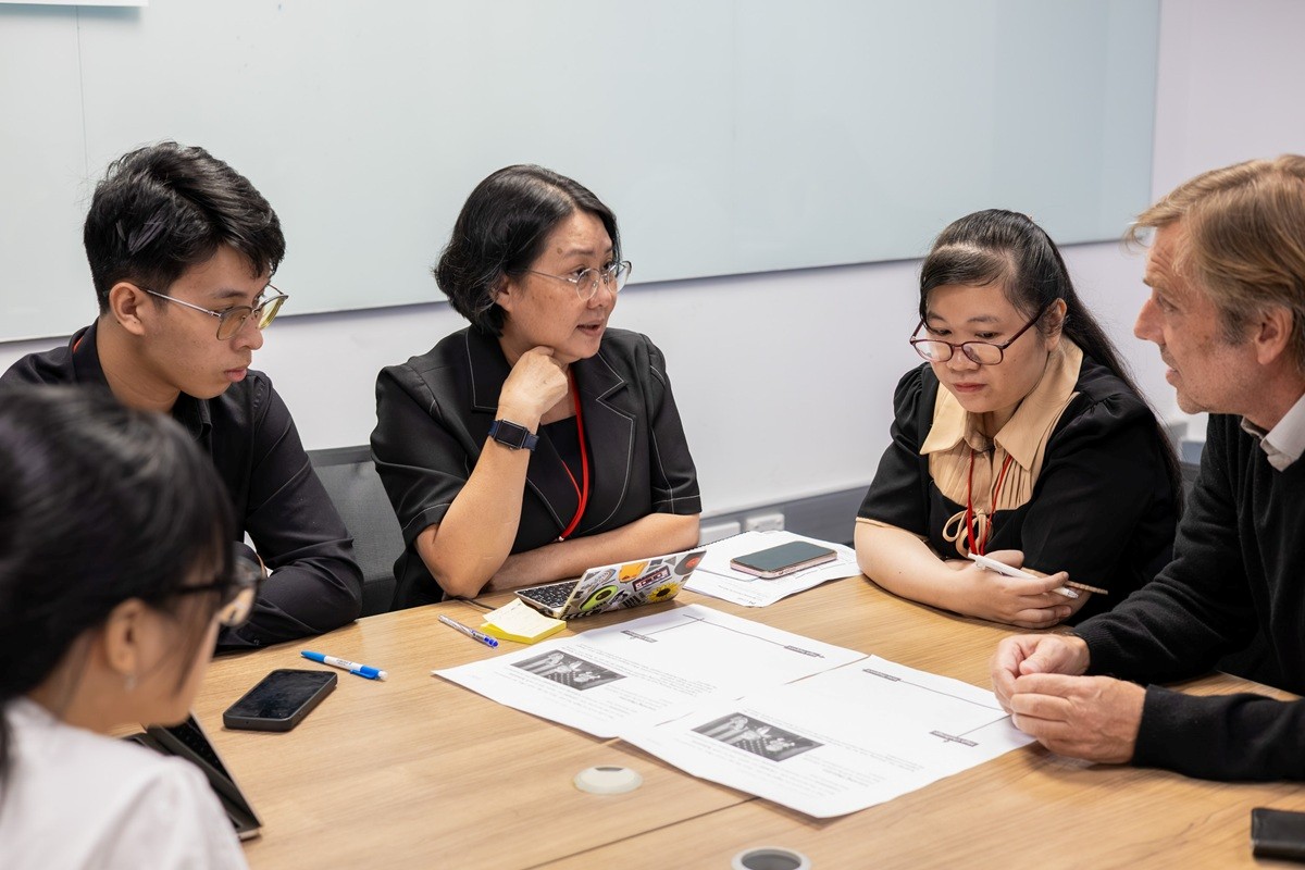 Five people discussing in a group