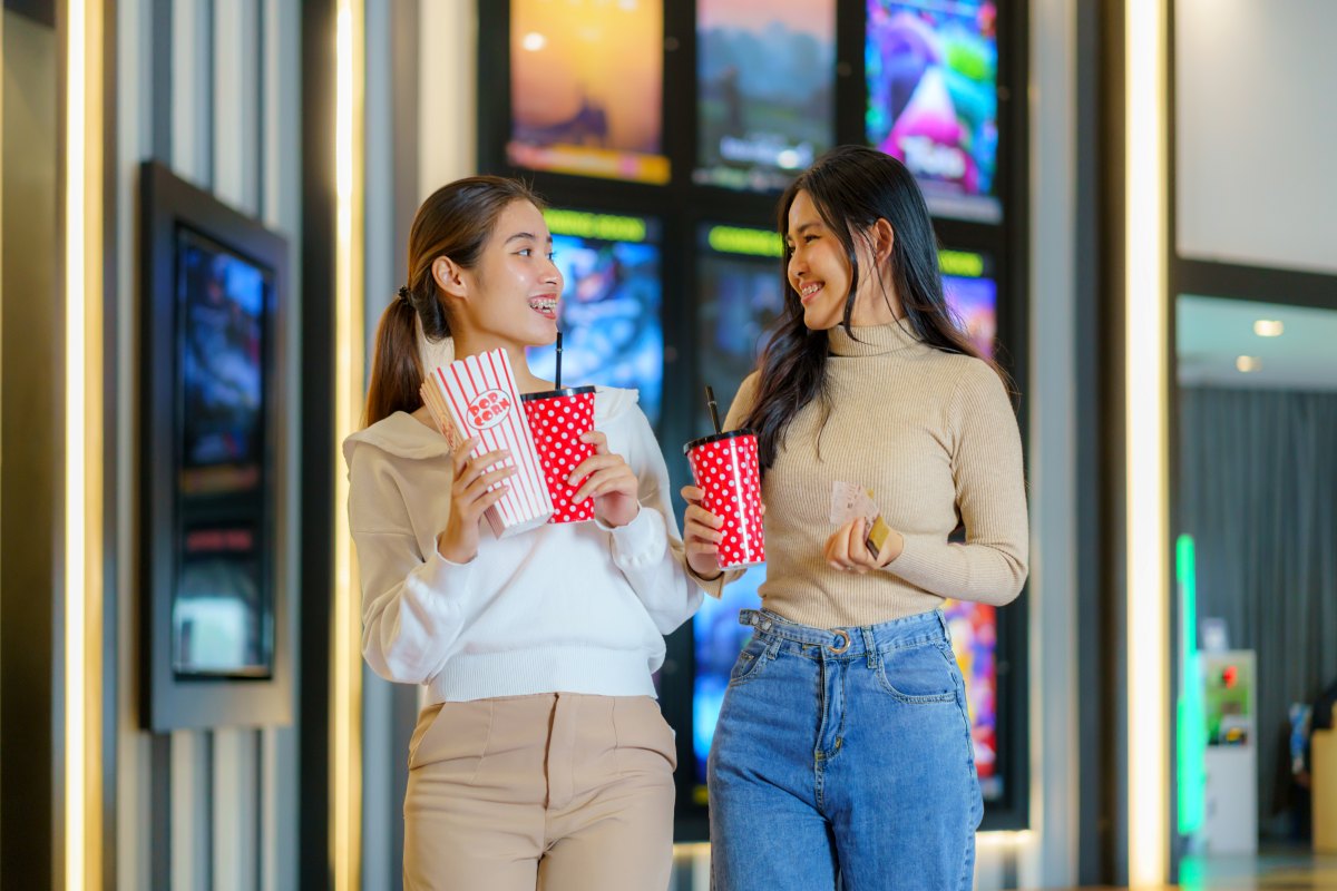Two cinema goers smiling