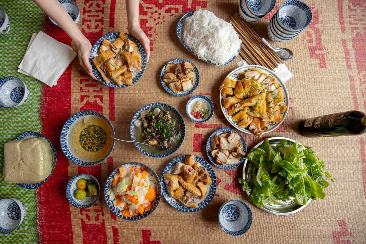 Vietnamese traditional lunar new year food laid out on a mat