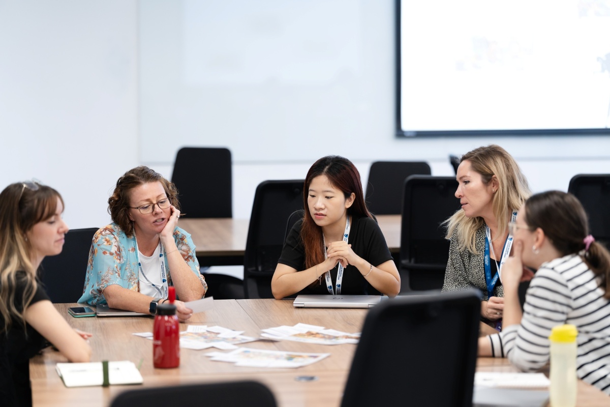 five people around a table