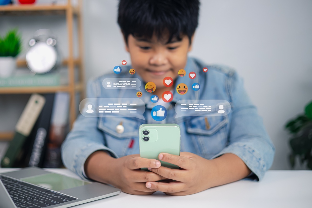 Young boy holding a smartphone