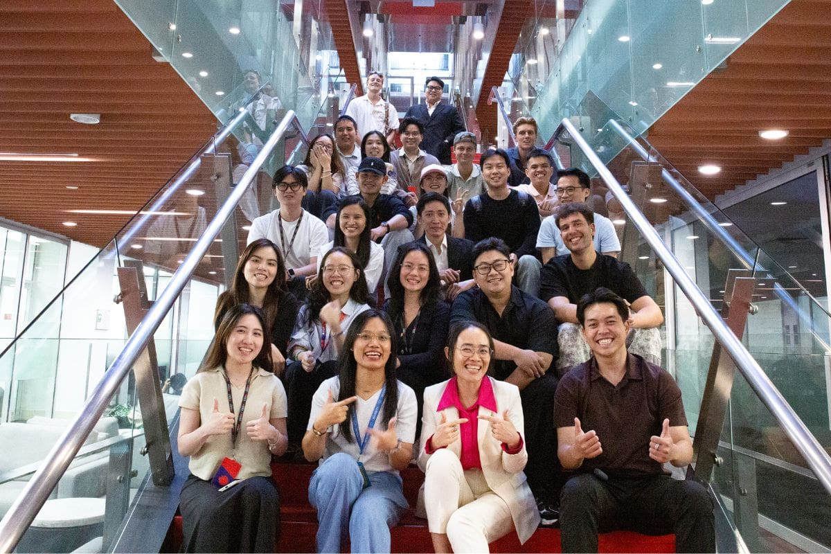 A group of MIB class students is posing for a class photo at RMIT Vietnam campus.