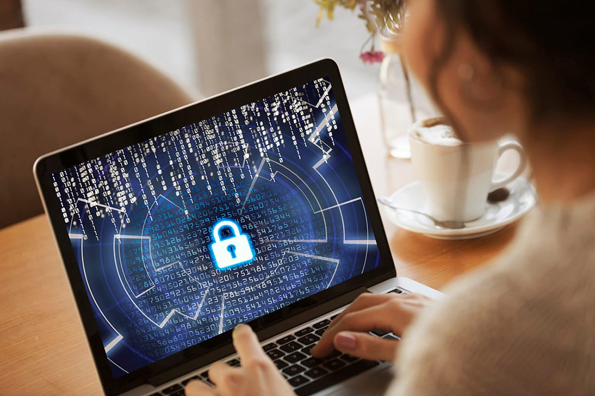 Headshot photo of a middle-aged man with glasses and mustache and wearing a suit