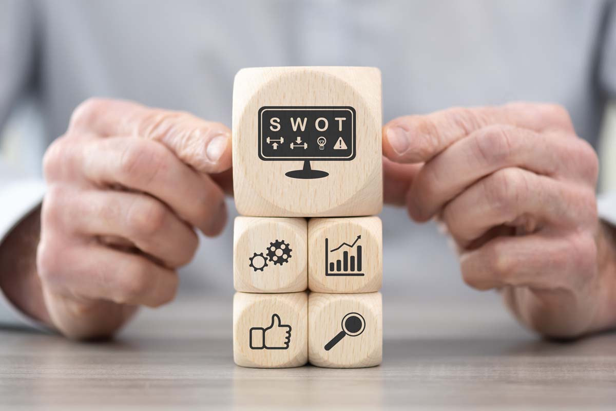 hand holding wooden block 