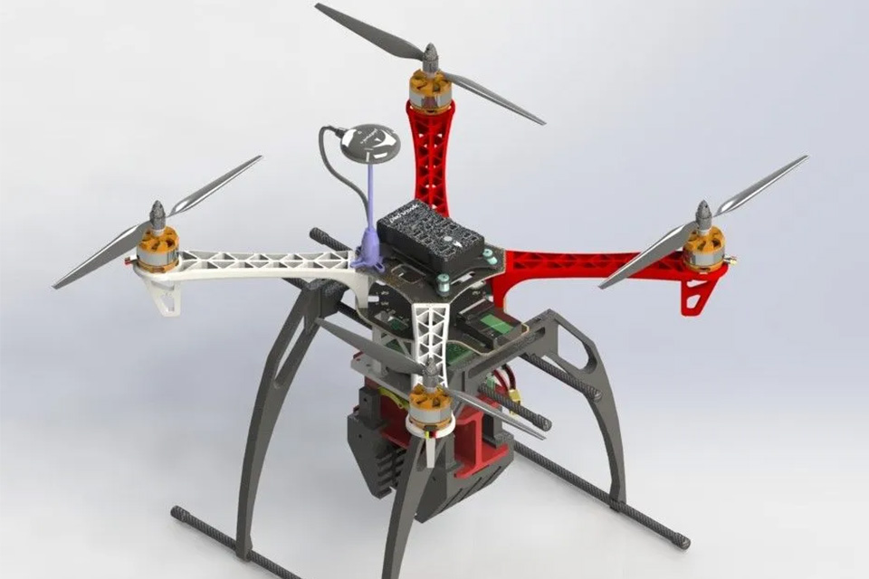 3D rendering of a drone prototype with a more complex frame, equipped with four rotors, a central body and additional components.