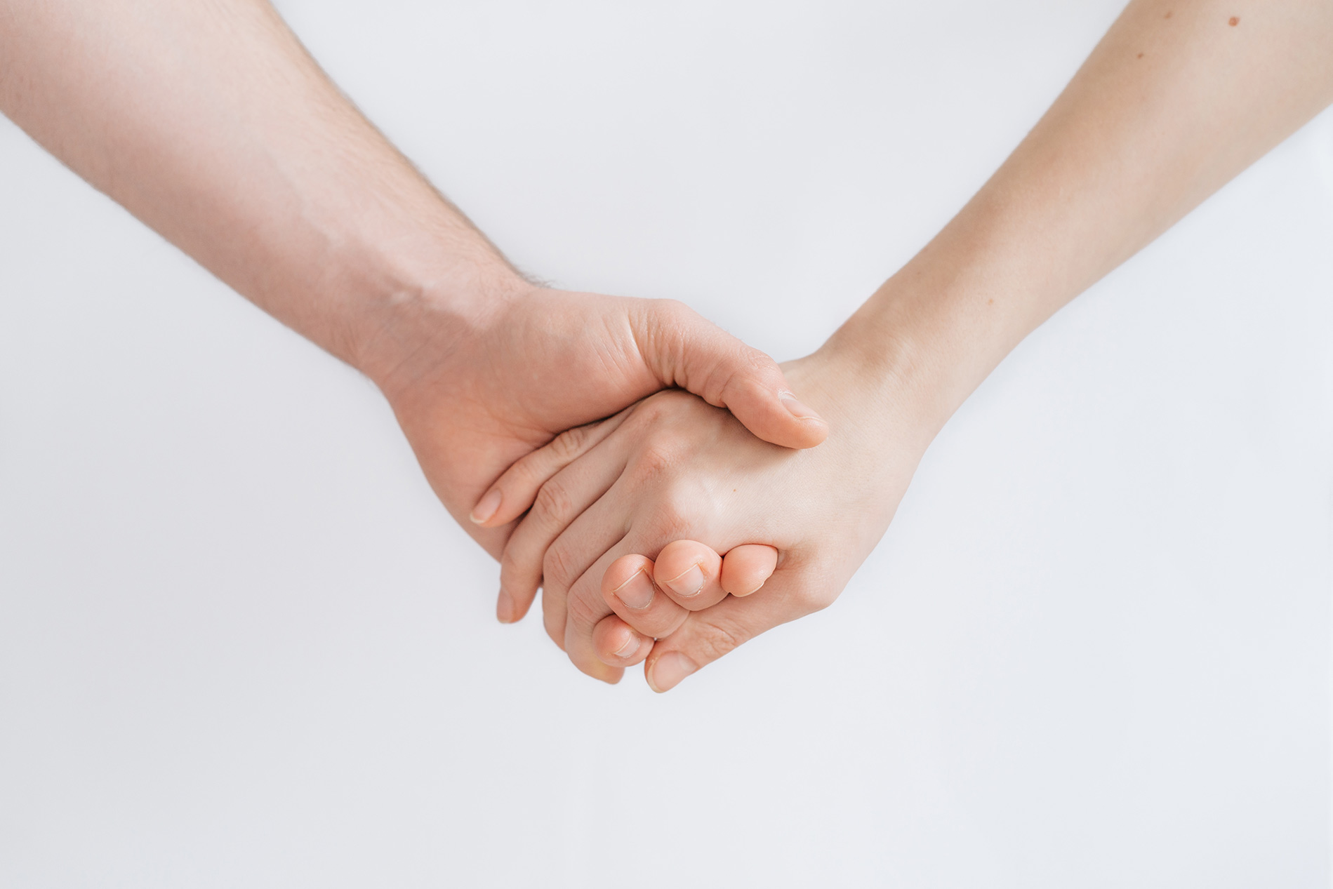 Isolate of 2 hands being held on a white background