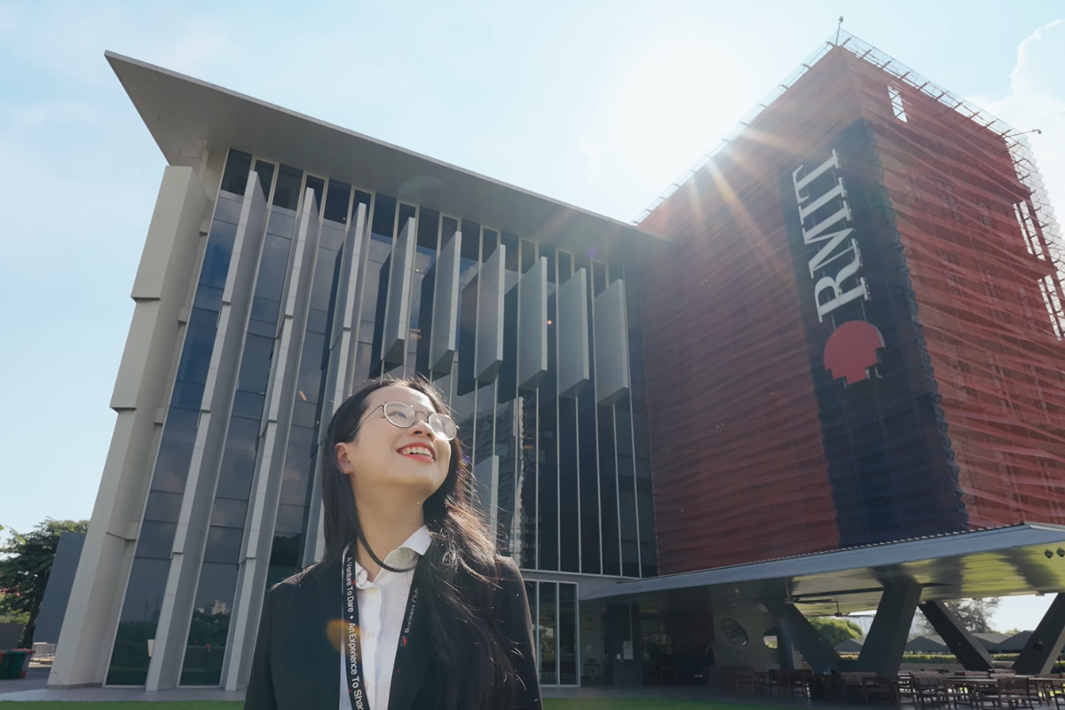 student-standing-before-sgs-campus-smiling